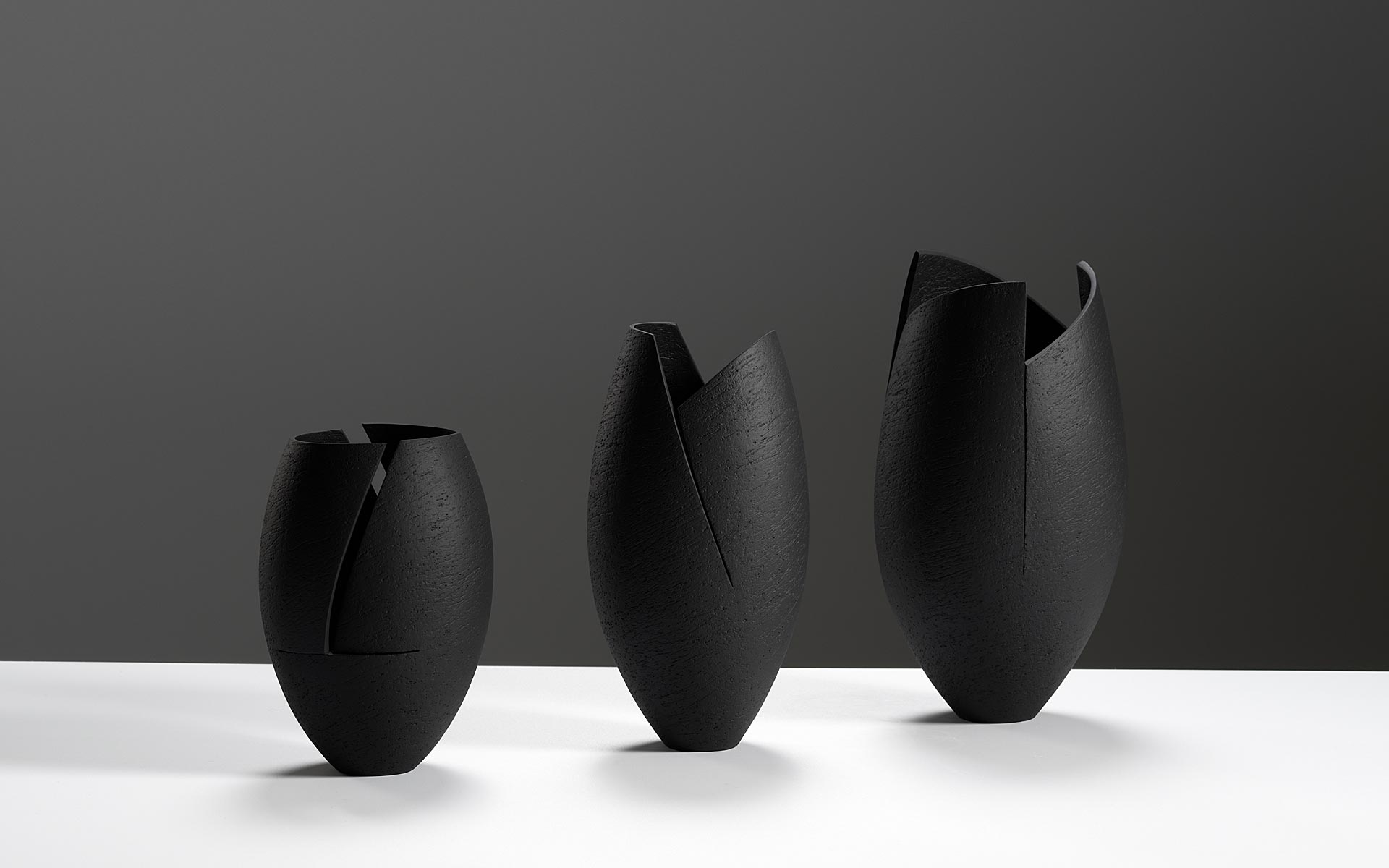 Group of black cut and altered vessels
