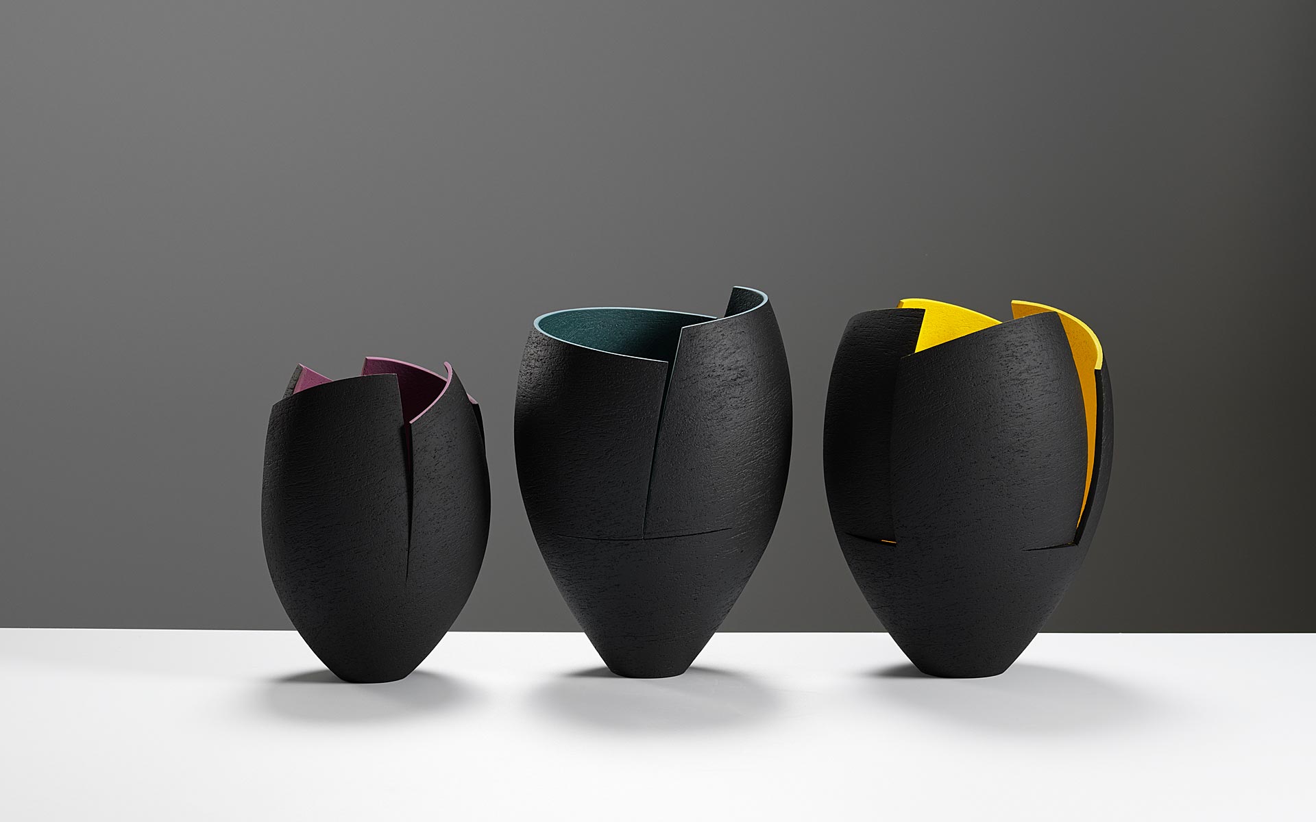 Group of cut and altered vessels with colours